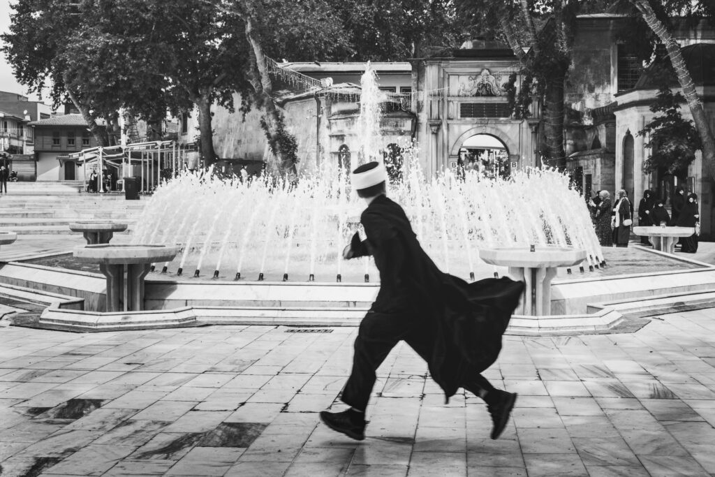 Fluid Escape , a young member of a religious sect is running in the old district of Eyüp captured during Istanbul Photo Tours